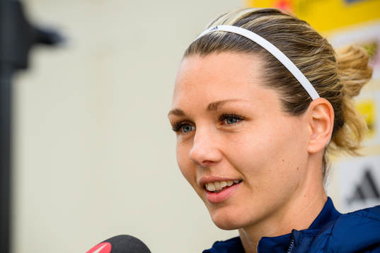 Goalkeeper Jennifer Falk is interviewed by the media