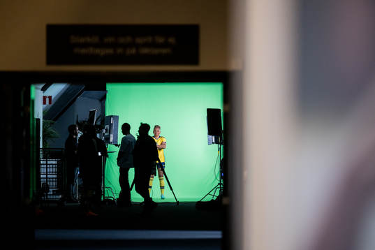 Madelen Janogy at a green screen filming with the women's
