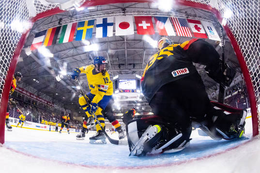Sara Hjalmarsson of Sweden  and goaltender Sandra
