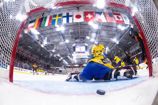 Franziska Feldmeier of Germany scores 1-1 behind goaltender