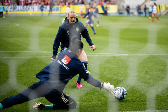 Stina Blackstenius and goalkeeper Zecira Musovic of Sweden