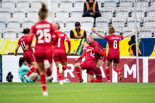 Stine Larsen of Denmark celebrates with team mates