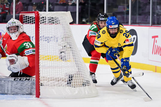 Sara Hjalmarsson of Sweden against goaltender Zsuzsa Revesz