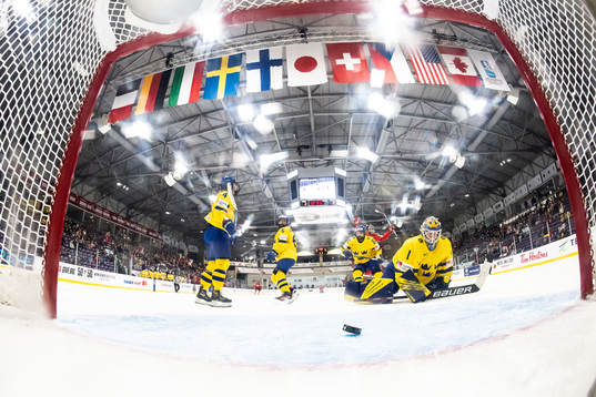 Mira Seregely of Hungary scores 2-1 behind goaltender Sara