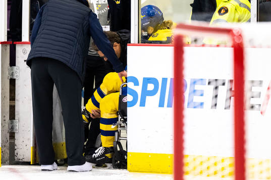 Paula Bergström of Sweden leaves the ice in a wheelchair
