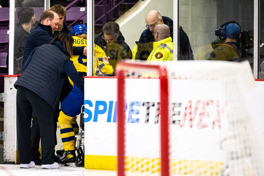 Paula Bergström of Sweden leaves the ice in a wheelchair