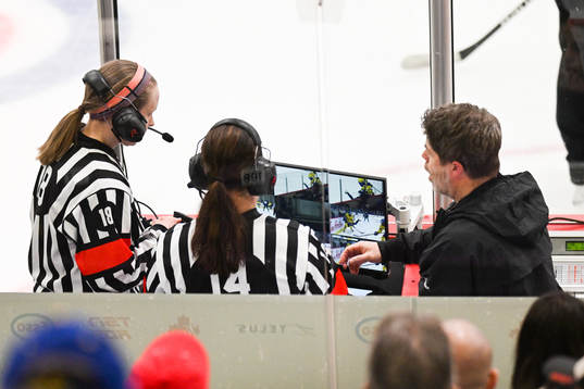 The referees are checking a situation