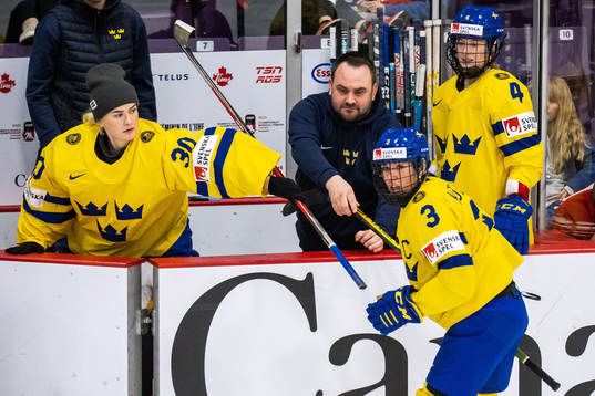 Anna Kjellbin of Sweden gets a new stick from goaltender