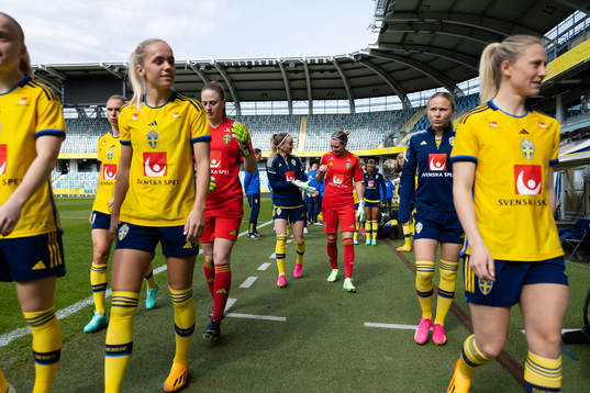 Kosovare Asllani and goalkeeper Jennifer Falk of the