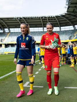 Kosovare Asllani and goalkeeper Jennifer Falk of the