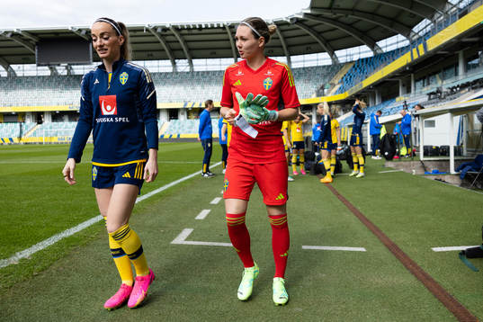 Kosovare Asllani and goalkeeper Jennifer Falk of the