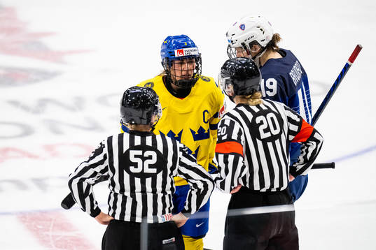 Anna Kjellbin of Sweden in a discussion with the referees