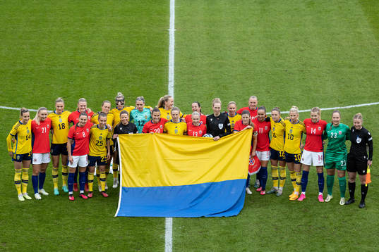 Players of Sweden and of Norway pose for a photo with the