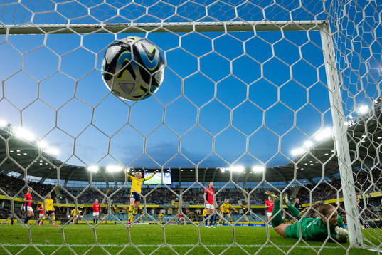 Olivia Schough of Sweden scores 3-2 behind goalkeeper