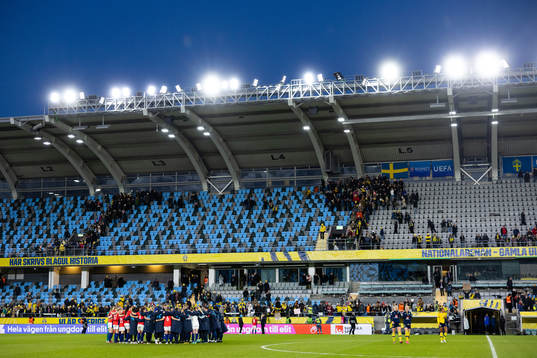 Players and staff gathered