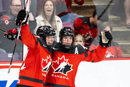 Claire Thompson and Blayre Turnbull of Canada celebrate 1-0