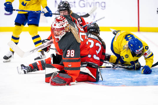 Goaltender Emerance Maschmeyer of Canada and Hilda Svensson