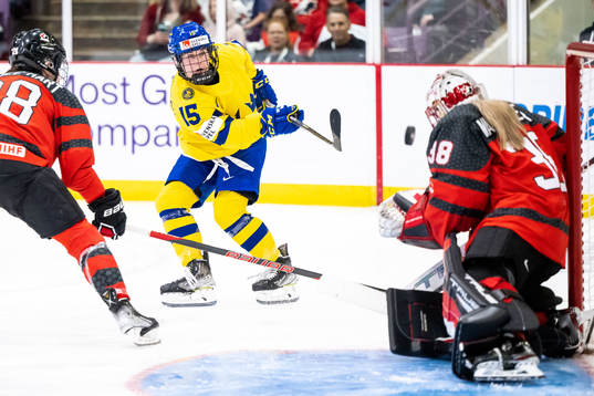 Lisa Johansson of Sweden and goaltender Emerance Maschmeyer
