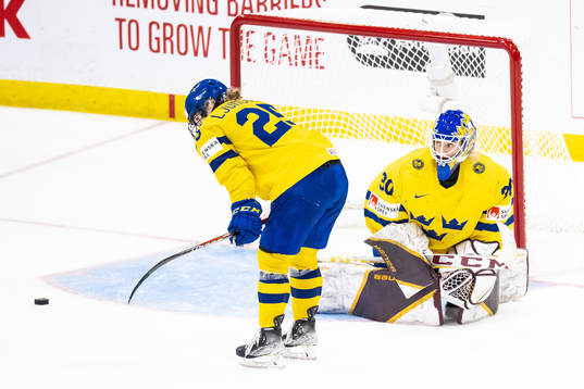 Lina Ljungblom and goaltender Emma Söderberg of Sweden
