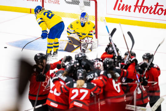 Lina Ljungblom and goaltender Emma Söderberg of Sweden