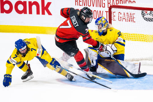 Mira Jungåker and goaltender Emma Söderberg of Sweden and