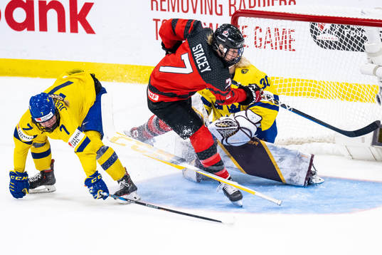 Mira Jungåker and goaltender Emma Söderberg of Sweden and
