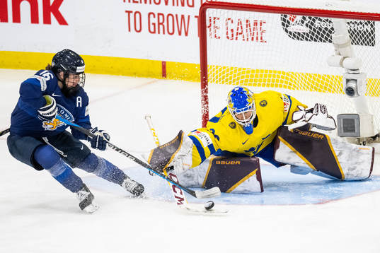 Petra Nieminen of Finland and goaltender Emma Söderberg of