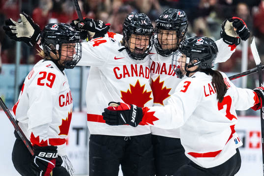 Renata Fast and Brianne Jenner of Canada celebrate scoring