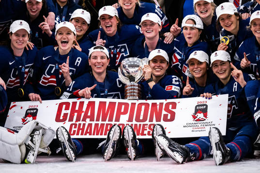 Players of USA celebrate winning the 2023 IIHF Women's