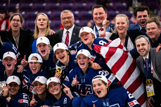 Players of USA celebrate winning the 2023 IIHF Women's