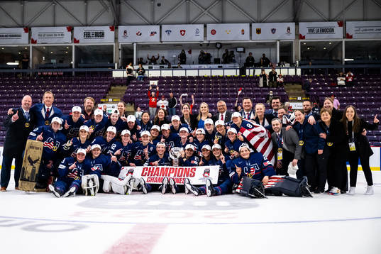 Players of USA celebrate winning the 2023 IIHF Women's