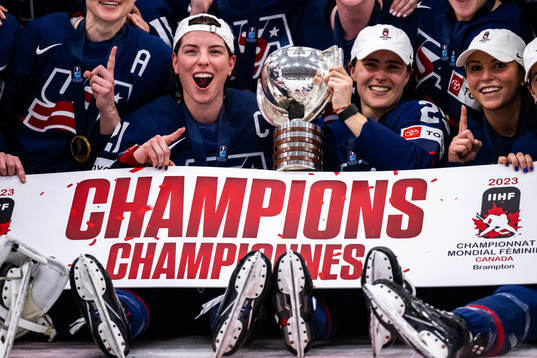 Players of USA celebrate winning the 2023 IIHF Women's