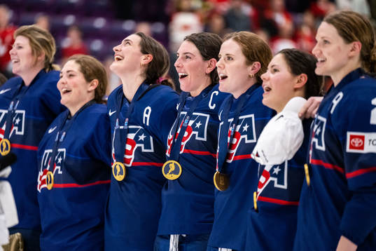 Players of USA celebrate winning the 2023 IIHF Women's