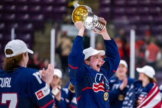 Players of USA celebrate winning the 2023 IIHF Women's