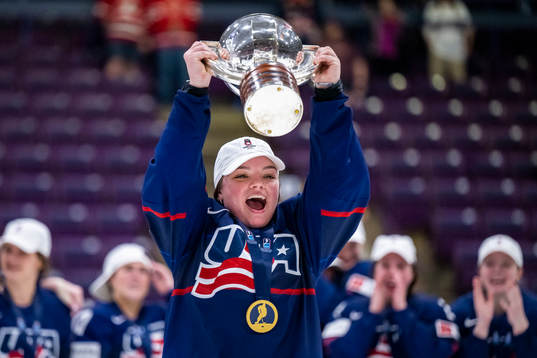 Players of USA celebrate winning the 2023 IIHF Women's