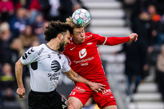 Diogo Tomas of Odd and Aune Heggebø of Brann
