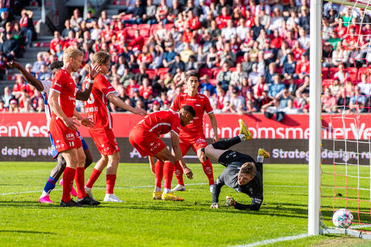 Japhet Sery Larsen and goalkeeper Mathias Dyngeland of