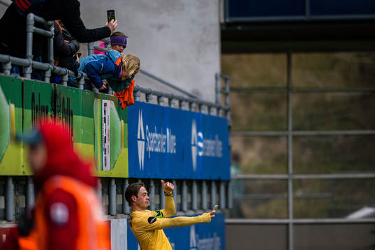 Patrick Berg of Bodø/Glimt taking a selfie with a fan