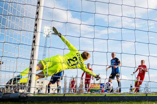 Bård Finne of Brann (not pictured) scores the 0-2 goal