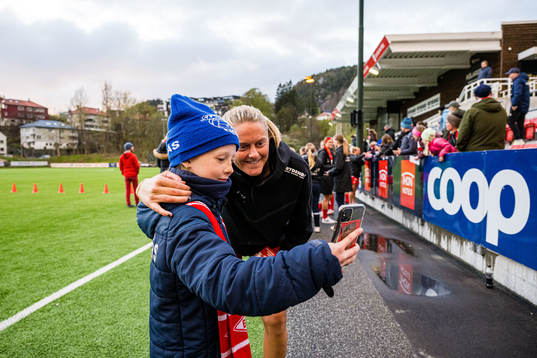 Maria Dybwad Brochmann of Brann taking a selfie with a fan