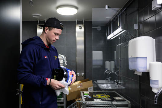 Lucas Raymond of Sweden cleans his helmet