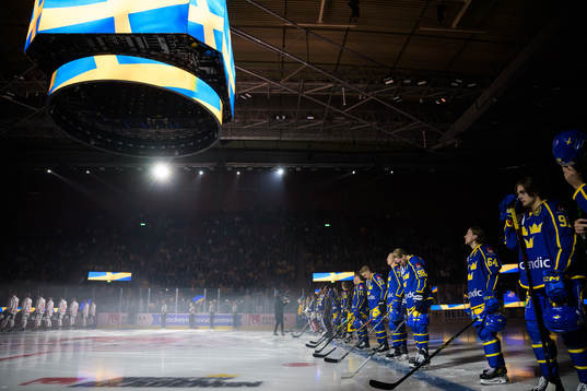 Players of Sweden are lined up for the national anthem