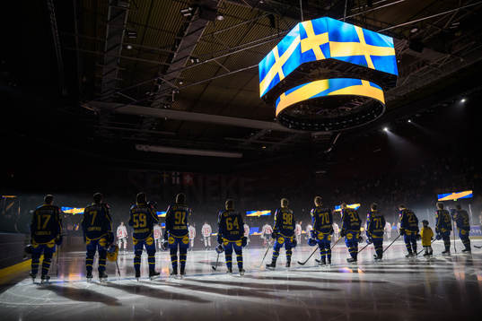 Players of Sweden are lined up for the national anthem