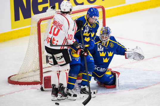 Andres Ambühl of Switzerland challenges Lukas Bengtsson