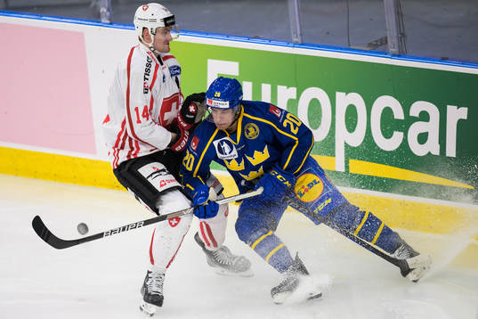 Dean Kukan of Switzerland and André Petersson of Sweden