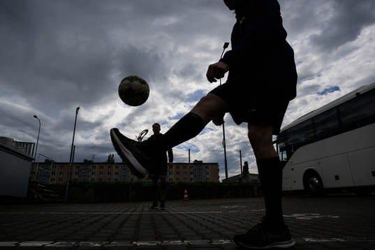 Jakob Silfverberg and Pär Lindholm of Sweden play football