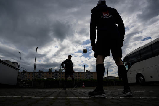 Jakob Silfverberg and Pär Lindholm of Sweden play football