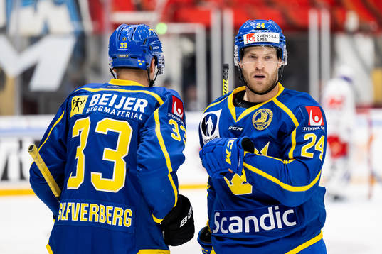 Jakob Silfverberg and Oscar Lindberg of Sweden celebrate