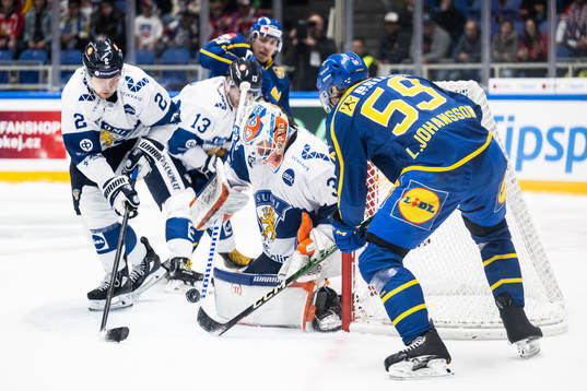 Ville Pokka and goaltender Christian Heljanko of Finland