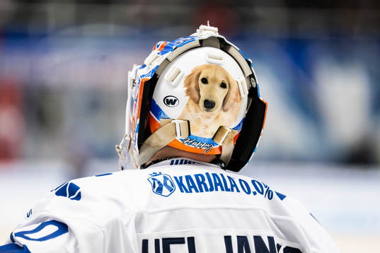 Goaltender Christian Heljanko of Finland with a picture of
